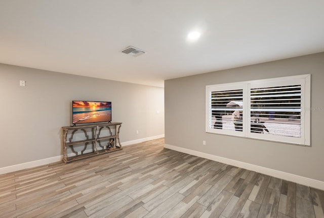 unfurnished living room featuring light hardwood / wood-style flooring