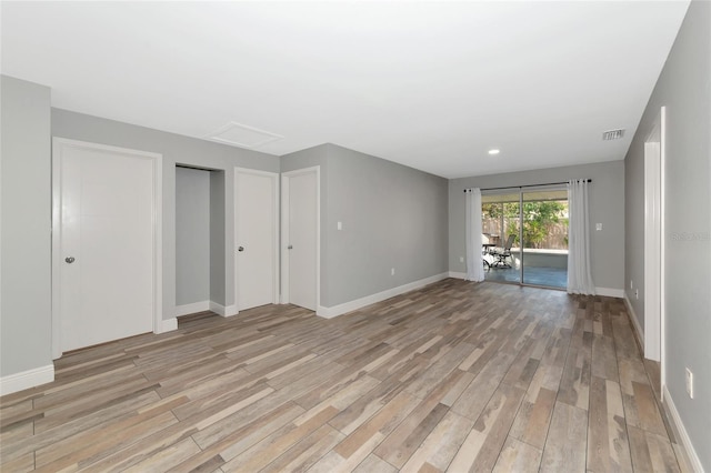 empty room with light wood-type flooring