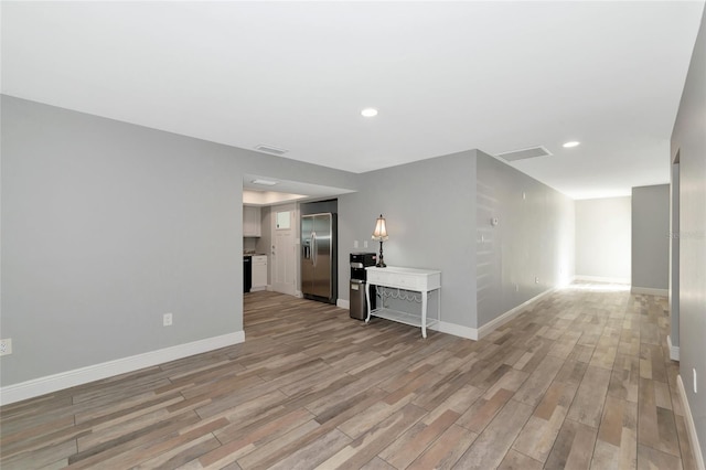 unfurnished room featuring light hardwood / wood-style flooring