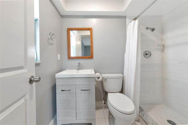 bathroom with vanity, curtained shower, and toilet