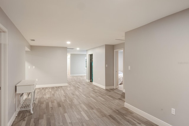 spare room featuring light wood-type flooring