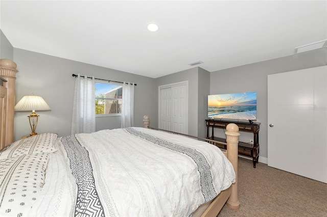 carpeted bedroom with a closet