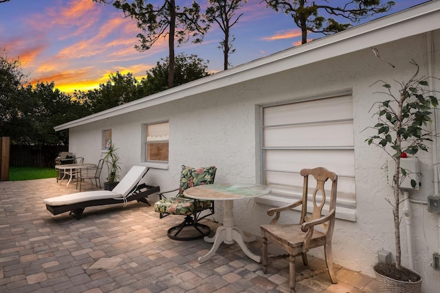 view of patio terrace at dusk