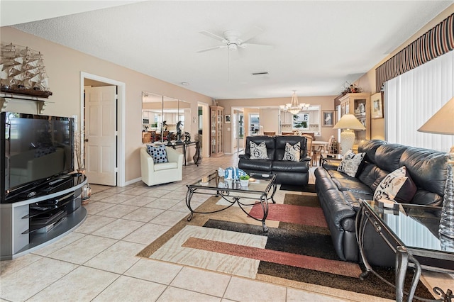 tiled living room featuring ceiling fan with notable chandelier