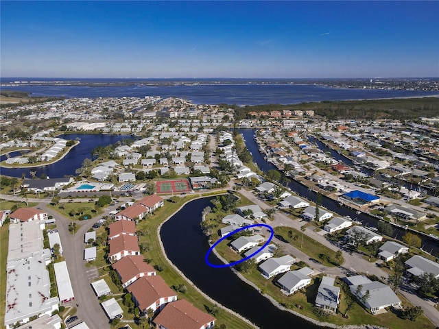 birds eye view of property with a water view