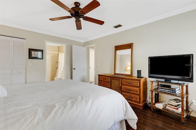 bedroom with a closet, ensuite bath, ceiling fan, and ornamental molding