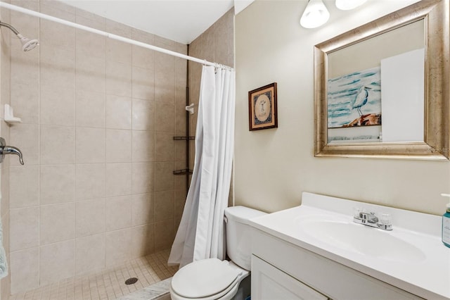 bathroom with toilet, vanity, and a shower with curtain