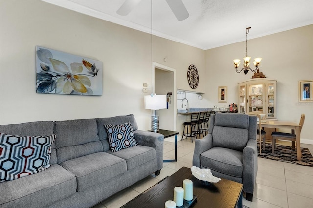 tiled living room featuring ceiling fan with notable chandelier and crown molding