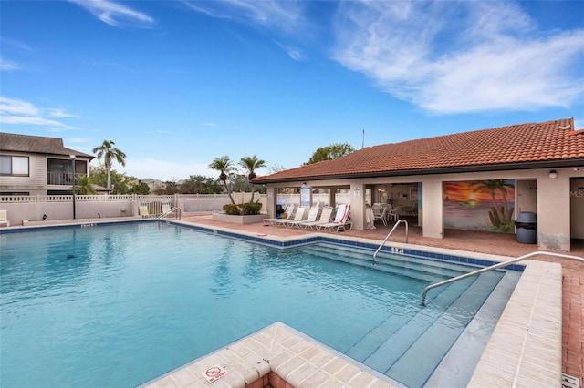 view of swimming pool with a patio area