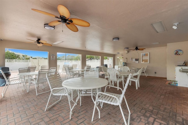 view of patio / terrace featuring ceiling fan