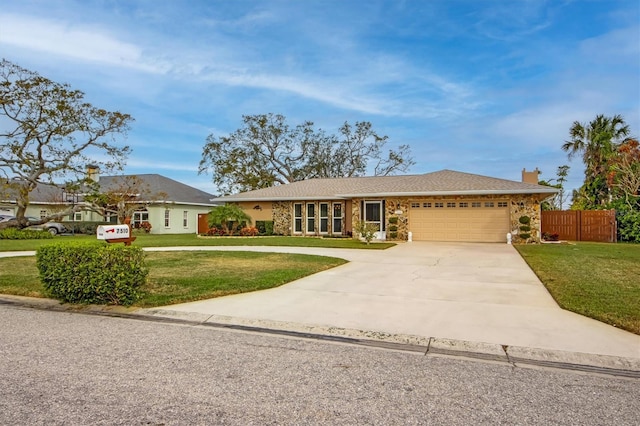 ranch-style home with a garage and a front lawn