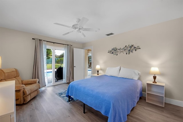 bedroom featuring light hardwood / wood-style flooring, access to outside, and ceiling fan