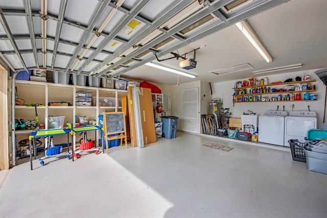 garage with a garage door opener and washing machine and clothes dryer