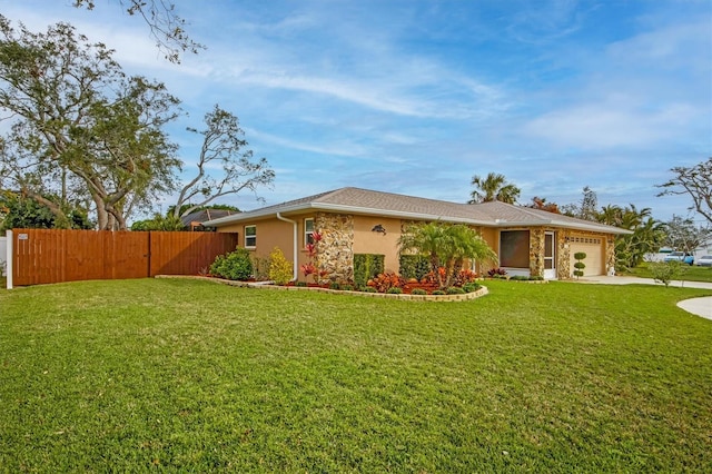 view of front facade featuring a garage and a front lawn