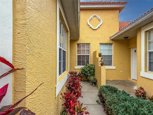 view of side of property with a patio area