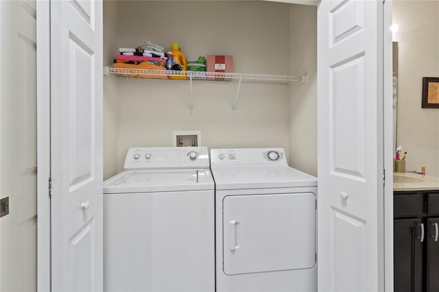 washroom with washing machine and clothes dryer