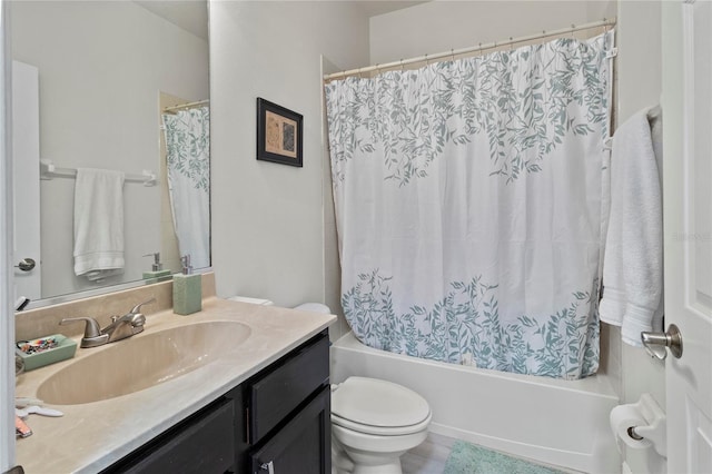 full bathroom featuring vanity, shower / bath combination with curtain, and toilet