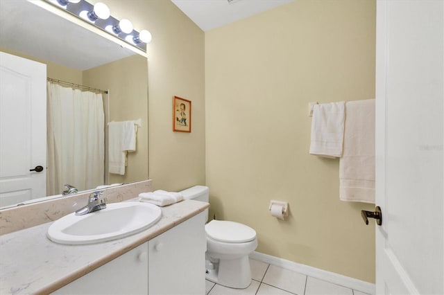 bathroom with vanity, tile patterned floors, and toilet