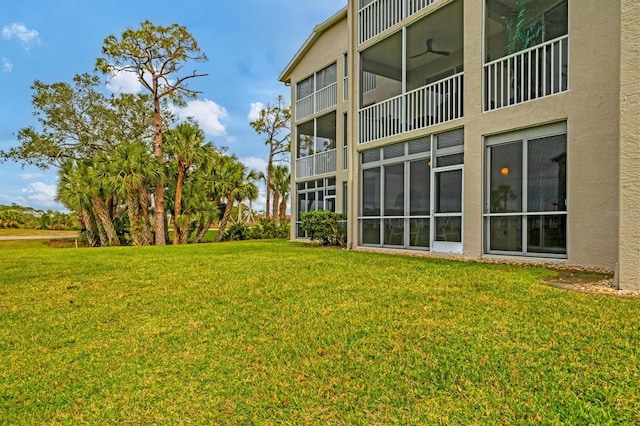 view of yard featuring ceiling fan