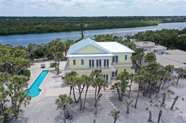 777 N Manasota Key Rd, Englewood, FL 34223 - view of subject property with a heavily wooded area, a pool area, and a nearby body of water