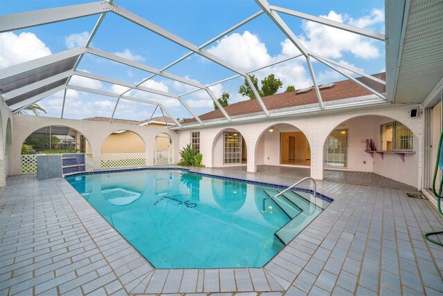 view of pool featuring a lanai and a patio area