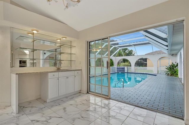 view of swimming pool featuring sink