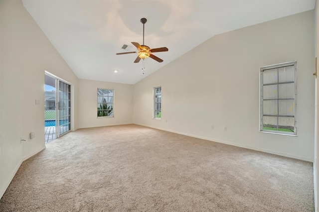 unfurnished room with ceiling fan, light colored carpet, and lofted ceiling