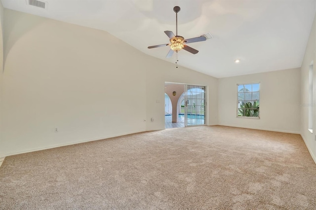 unfurnished living room featuring ceiling fan, lofted ceiling, and carpet