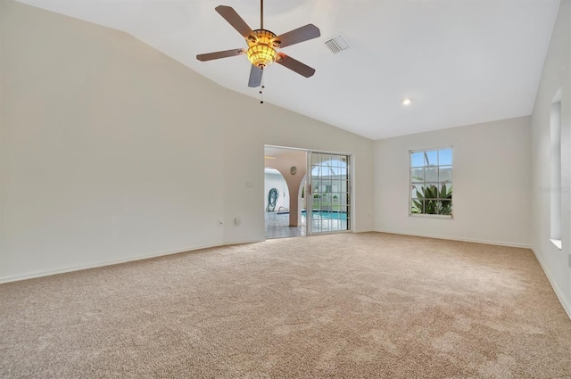 unfurnished living room featuring carpet, lofted ceiling, and ceiling fan