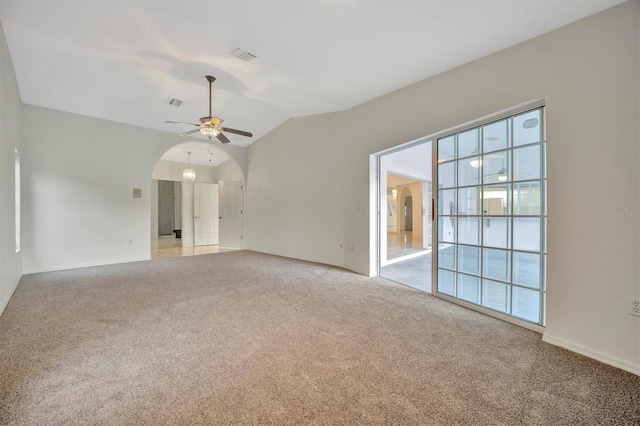 unfurnished living room with light carpet, lofted ceiling, and ceiling fan