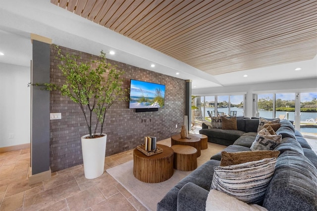 living room with brick wall