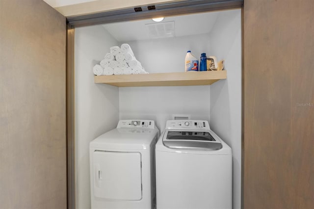 washroom with washing machine and dryer