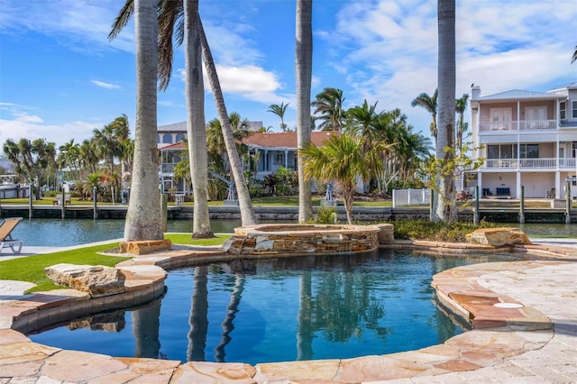 view of swimming pool with a water view