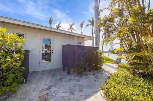 view of property exterior with a patio