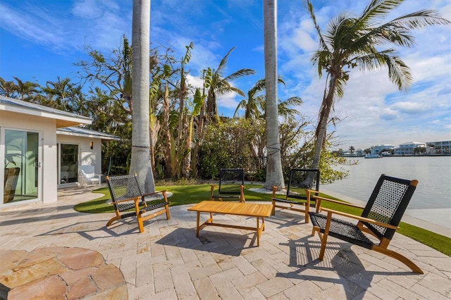 view of patio featuring a water view