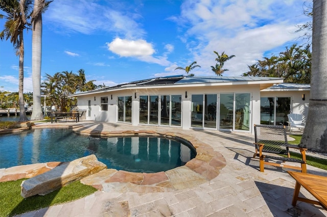 view of swimming pool featuring a patio area