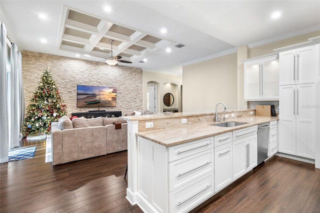 kitchen with sink, coffered ceiling, white cabinetry, and beam ceiling