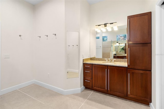 bathroom with vanity and tile patterned flooring