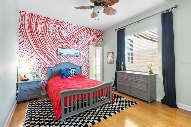 bedroom featuring ceiling fan and light hardwood / wood-style flooring