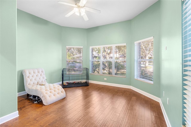 sitting room featuring ceiling fan and wood-type flooring