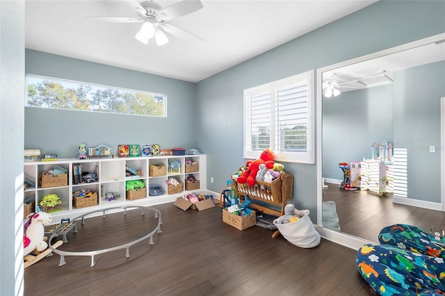 game room featuring ceiling fan, plenty of natural light, and dark hardwood / wood-style flooring