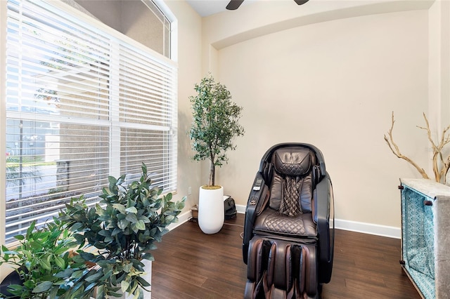 sitting room featuring ceiling fan and dark hardwood / wood-style flooring