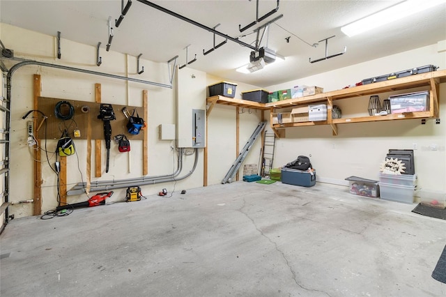 garage featuring a garage door opener and electric panel