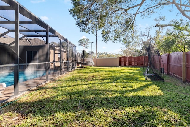 view of yard with a lanai