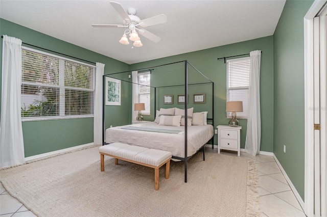 bedroom featuring ceiling fan and light tile patterned flooring