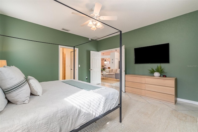 tiled bedroom with ceiling fan