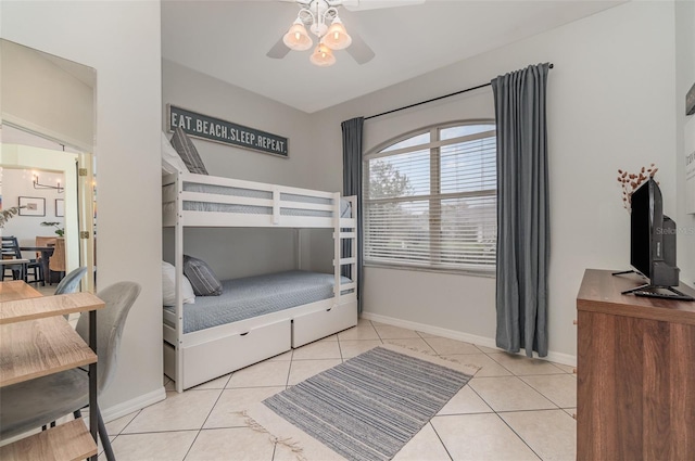 tiled bedroom with ceiling fan