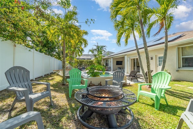 view of yard with an outdoor fire pit