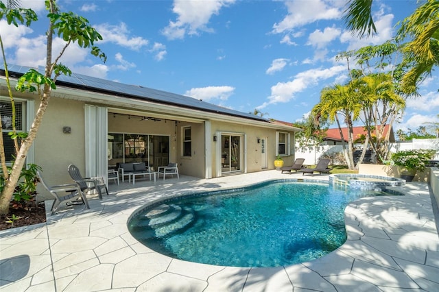 view of pool with an in ground hot tub, a patio area, and an outdoor hangout area