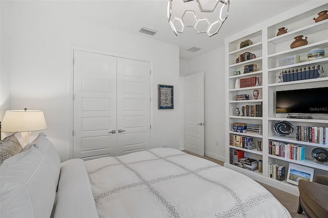 bedroom featuring visible vents and a closet